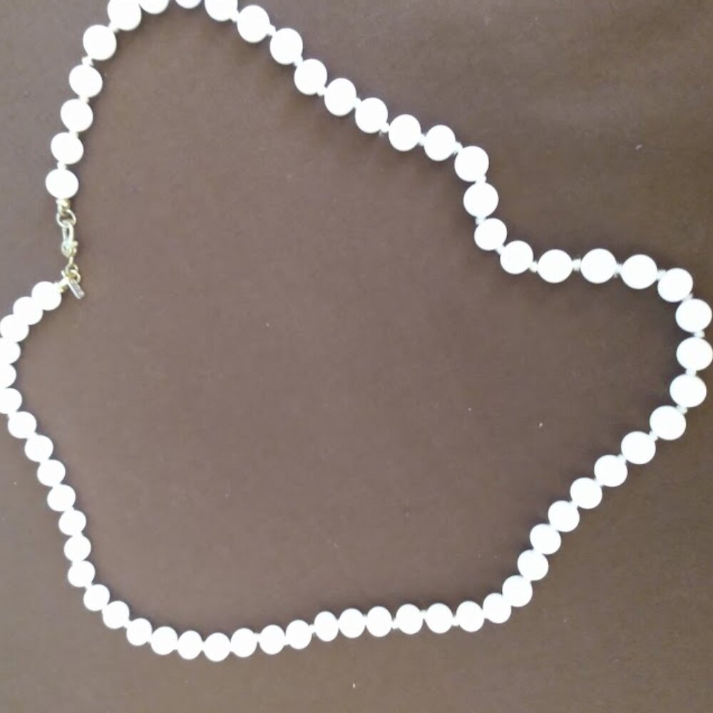 Monet: Vintage white glass beaded  necklace. Knotted between each bead.